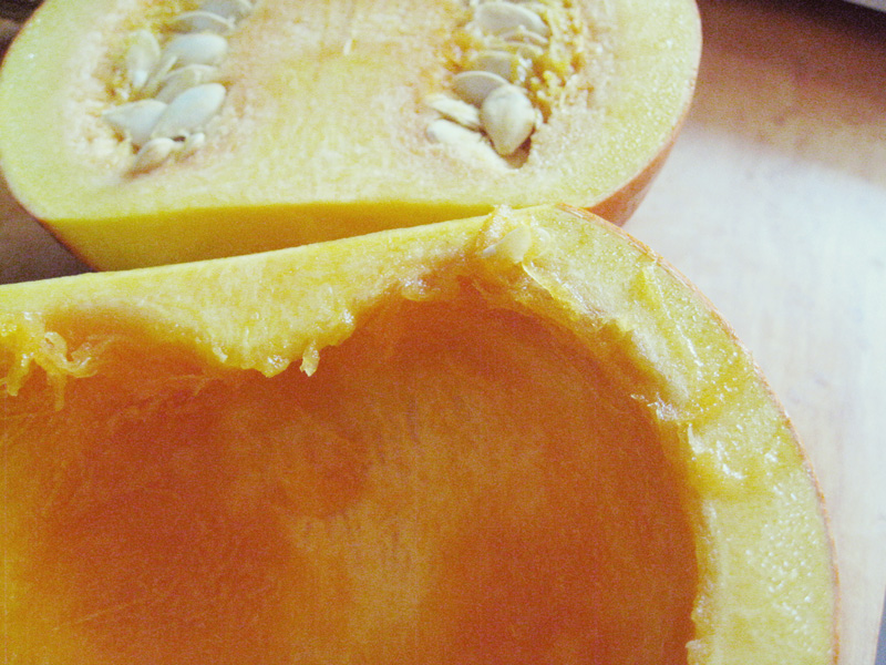 Scrape the pumpkin to remove the seeds and yellow gunk